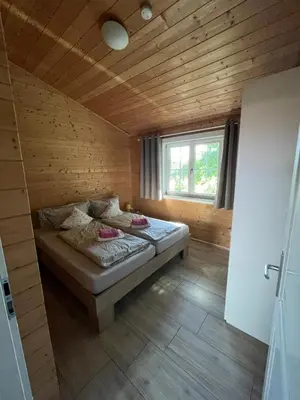 Ein Bett oder Betten in einem Zimmer der Unterkunft Silence-Lodge