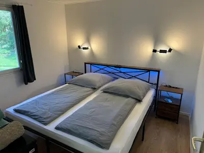Ein Bett oder Betten in einem Zimmer der Unterkunft Feriendorf Seddiner See - Bungalow 5