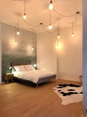 Ein Bett oder Betten in einem Zimmer der Unterkunft Designer open plan apartment Friedrichshain
