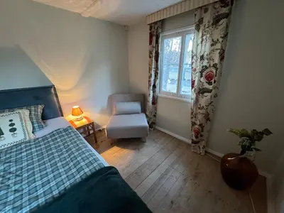 Ein Bett oder Betten in einem Zimmer der Unterkunft Liebenswertes Sommerhaus in Seenähe