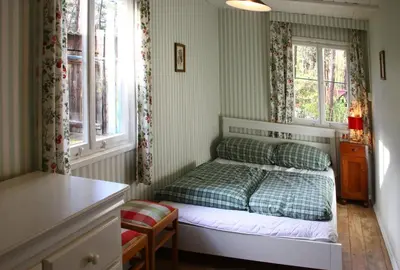 Ein Bett oder Betten in einem Zimmer der Unterkunft Liebenswertes Sommerhaus in Seenähe