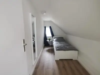 Ein Bett oder Betten in einem Zimmer der Unterkunft Apartmenthaus in Rüdersdorf