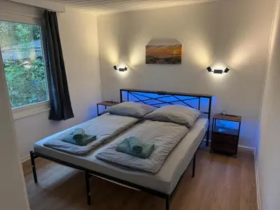 Ein Bett oder Betten in einem Zimmer der Unterkunft Bungalowdorf Seddiner See - Bungalow 9