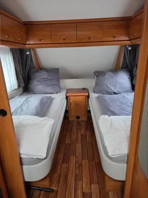 Ein Bett oder Betten in einem Zimmer der Unterkunft Feriencamp Familie Lange - Primc
