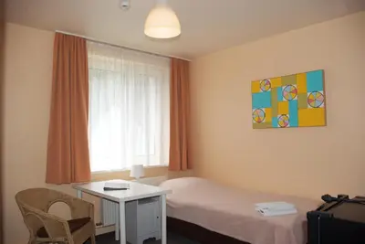 Ein Bett oder Betten in einem Zimmer der Unterkunft Apartmentpension Am Krongut
