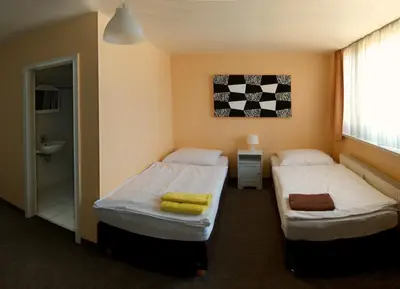 Ein Bett oder Betten in einem Zimmer der Unterkunft Apartmentpension Am Krongut