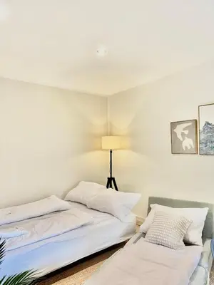Ein Bett oder Betten in einem Zimmer der Unterkunft Cosy Remise Apartment Berlin Reinickendorf