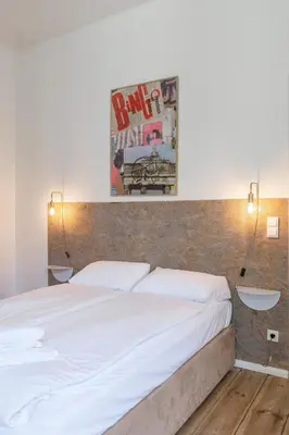 Ein Bett oder Betten in einem Zimmer der Unterkunft Mooeve Boxi Big Apartments