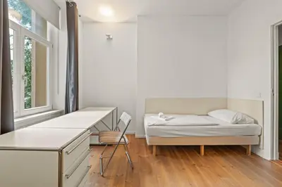 Ein Bett oder Betten in einem Zimmer der Unterkunft Mooeve Boxi Big Apartments