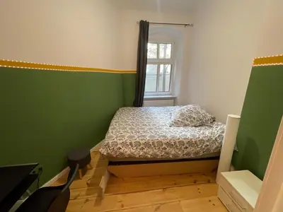 Ein Bett oder Betten in einem Zimmer der Unterkunft The Cozy Green