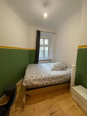 Ein Bett oder Betten in einem Zimmer der Unterkunft The Cozy Green