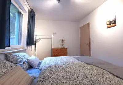 Ein Bett oder Betten in einem Zimmer der Unterkunft Ferienhaus Seensucht - Natur am See & im Wald mit Kamin