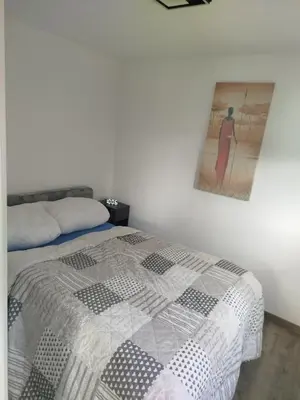 Ein Bett oder Betten in einem Zimmer der Unterkunft Rotes Haus