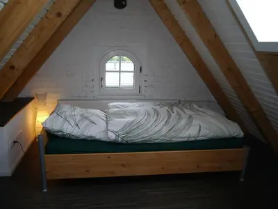 Ein Bett oder Betten in einem Zimmer der Unterkunft Ferienwohnung im Neubauernweg 3