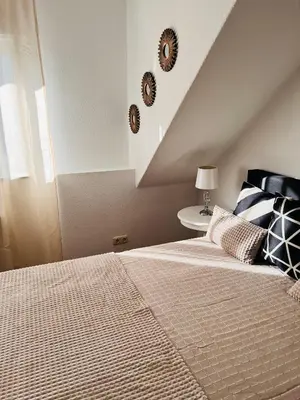 Ein Bett oder Betten in einem Zimmer der Unterkunft Zapfwerk-Rooms