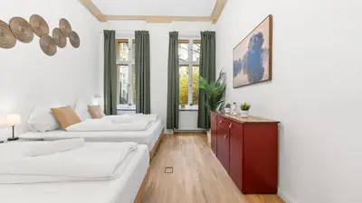 Ein Bett oder Betten in einem Zimmer der Unterkunft Design Apartment in Prenzlauer Berg - 79 QM