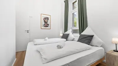 Ein Bett oder Betten in einem Zimmer der Unterkunft Design Apartment in Prenzlauer Berg - 79 QM