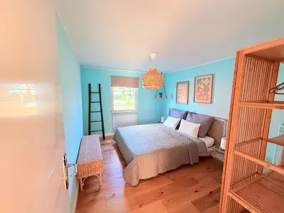 Ein Bett oder Betten in einem Zimmer der Unterkunft Ferienhaus Sanibel mit Kaminofen