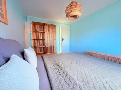 Ein Bett oder Betten in einem Zimmer der Unterkunft Ferienhaus Sanibel mit Kaminofen