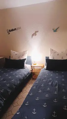 Ein Bett oder Betten in einem Zimmer der Unterkunft Ferienhaus - Ankerplatz am Werlsee, mit eigenem Bootssteg und Sauna