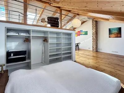 Ein Bett oder Betten in einem Zimmer der Unterkunft HolidayHome Apartments|Luxury Loft-Style Apartment