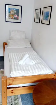 Ein Bett oder Betten in einem Zimmer der Unterkunft Tripplezimmer mit Garten, Kicker und Grill