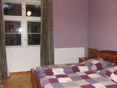 Ein Bett oder Betten in einem Zimmer der Unterkunft Villa Vogelweide