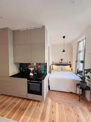 Ein Bett oder Betten in einem Zimmer der Unterkunft Chic Boutique Studio with Balcony in Prenzlauer Berg