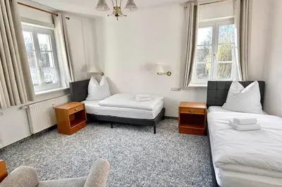 Ein Bett oder Betten in einem Zimmer der Unterkunft Schlösschen am Rhinufer