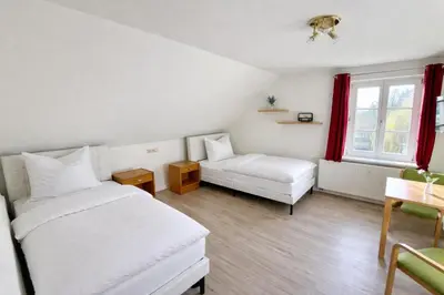 Ein Bett oder Betten in einem Zimmer der Unterkunft Schlösschen am Rhinufer