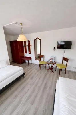 Ein Bett oder Betten in einem Zimmer der Unterkunft Schlösschen am Rhinufer