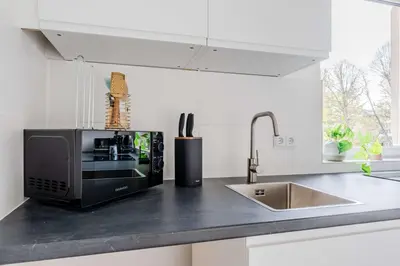 Küche/Küchenzeile in der Unterkunft Modernes Apartment im Holländischen Viertel