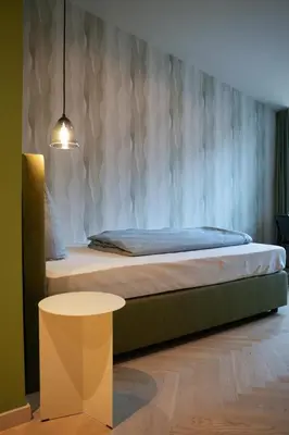 Ein Bett oder Betten in einem Zimmer der Unterkunft qnorke Hotel