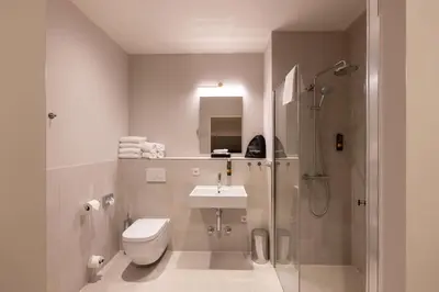Ein Badezimmer in der Unterkunft qnorke Hotel