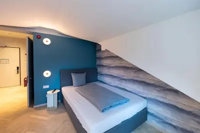 Ein Bett oder Betten in einem Zimmer der Unterkunft qnorke Hotel