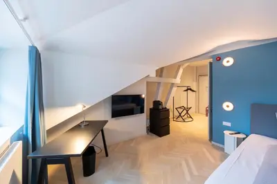 Ein Bett oder Betten in einem Zimmer der Unterkunft qnorke Hotel