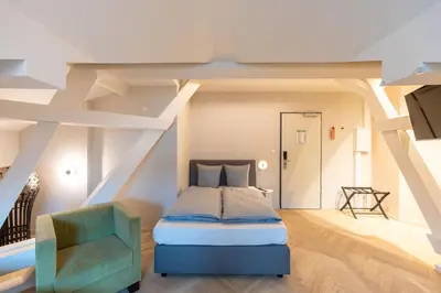 Ein Bett oder Betten in einem Zimmer der Unterkunft qnorke Hotel