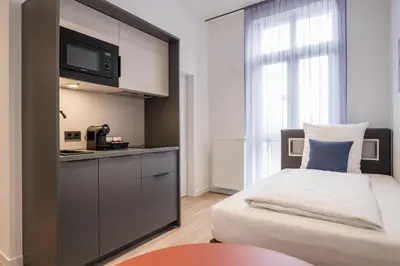 Ein Bett oder Betten in einem Zimmer der Unterkunft Homaris Rummelsburg Studios
