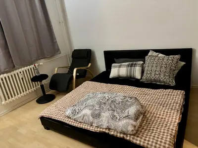 Ein Bett oder Betten in einem Zimmer der Unterkunft Ezzat