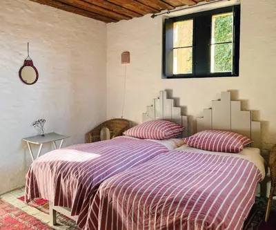Ein Bett oder Betten in einem Zimmer der Unterkunft Sanssouci Park Villa