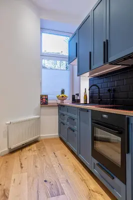 Küche/Küchenzeile in der Unterkunft FABEL Apartments am Hbf