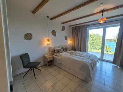 Ein Bett oder Betten in einem Zimmer der Unterkunft Monteurzimmer 6 mit Seeblick