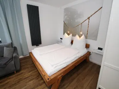 Ein Bett oder Betten in einem Zimmer der Unterkunft Ferienhaus direkt an der Spree