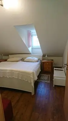 Ein Bett oder Betten in einem Zimmer der Unterkunft Ferienappartements Schweizer Haus
