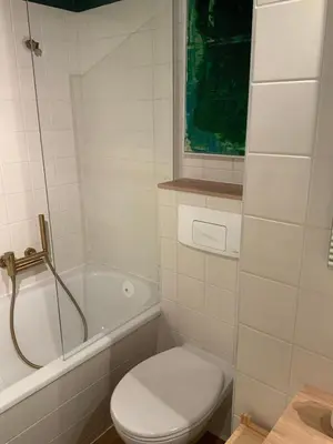 Ein Badezimmer in der Unterkunft Apartment mit Garten - Garden view