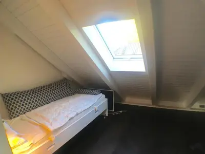 Ein Bett oder Betten in einem Zimmer der Unterkunft Exklusives DG-Apartment in Berlin Pankow