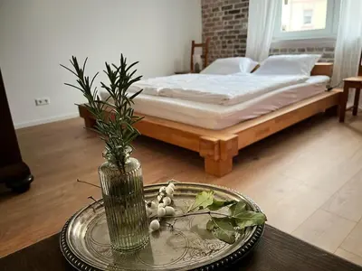 Ein Bett oder Betten in einem Zimmer der Unterkunft Sauna Suite Schwante mit Klavier