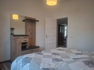 Ein Bett oder Betten in einem Zimmer der Unterkunft FeWo Auguststraße