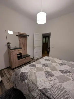 Ein Bett oder Betten in einem Zimmer der Unterkunft FeWo Auguststraße