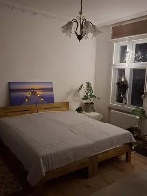 Ein Bett oder Betten in einem Zimmer der Unterkunft FeWo Auguststraße